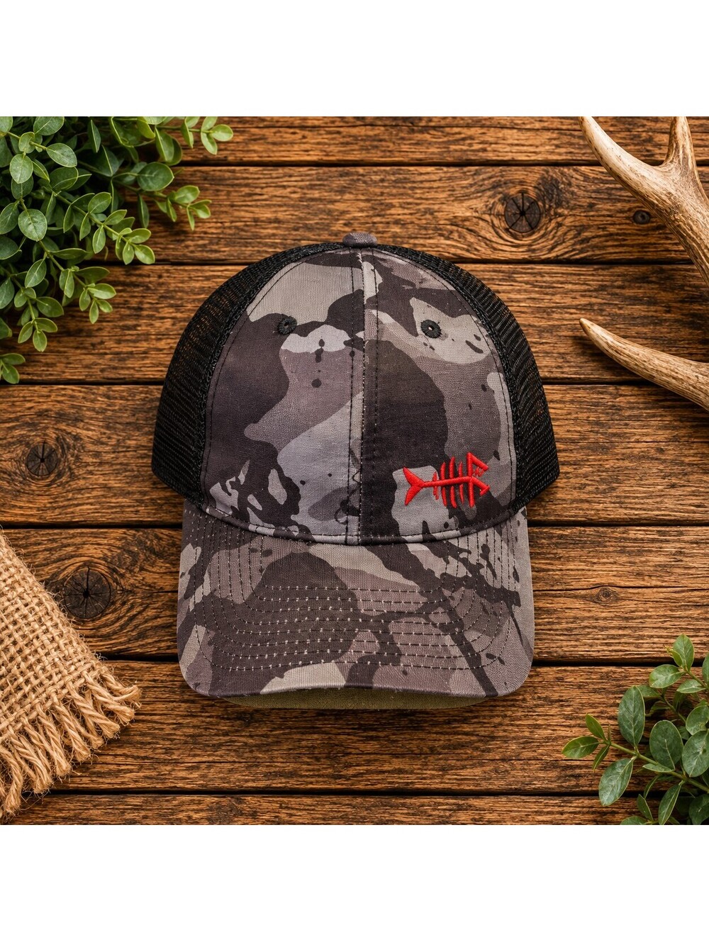 Camo trucker cap with red logo, snapback